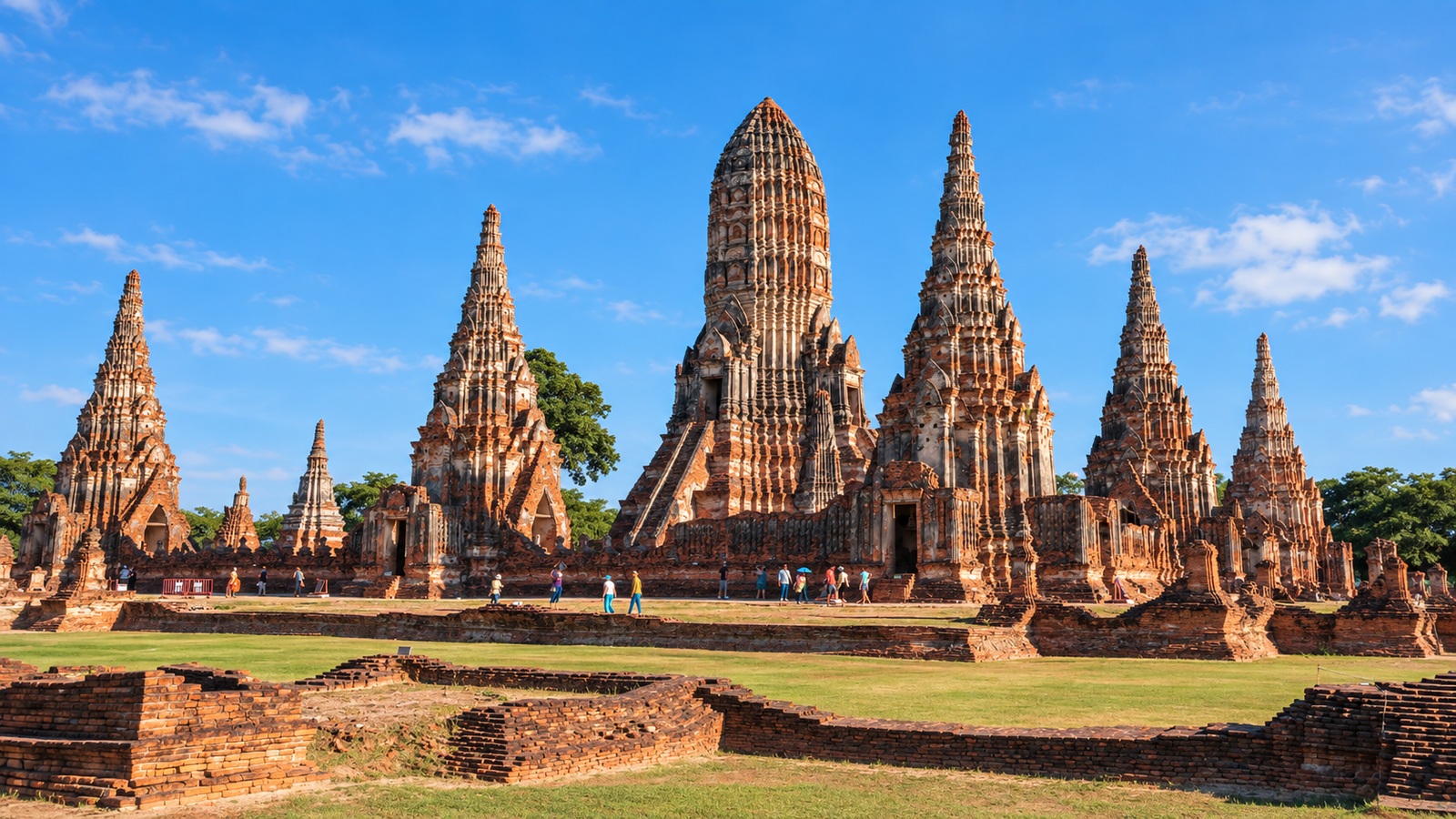 AI Illustration of Wat Chaiwatthanaram in Ayutthaya, with its central prang and surrounding brick towers under a blue sky.